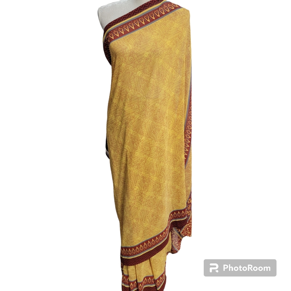 Maroon or brown polyester/chiffon style saree/sari with yellow, brown, red leaf